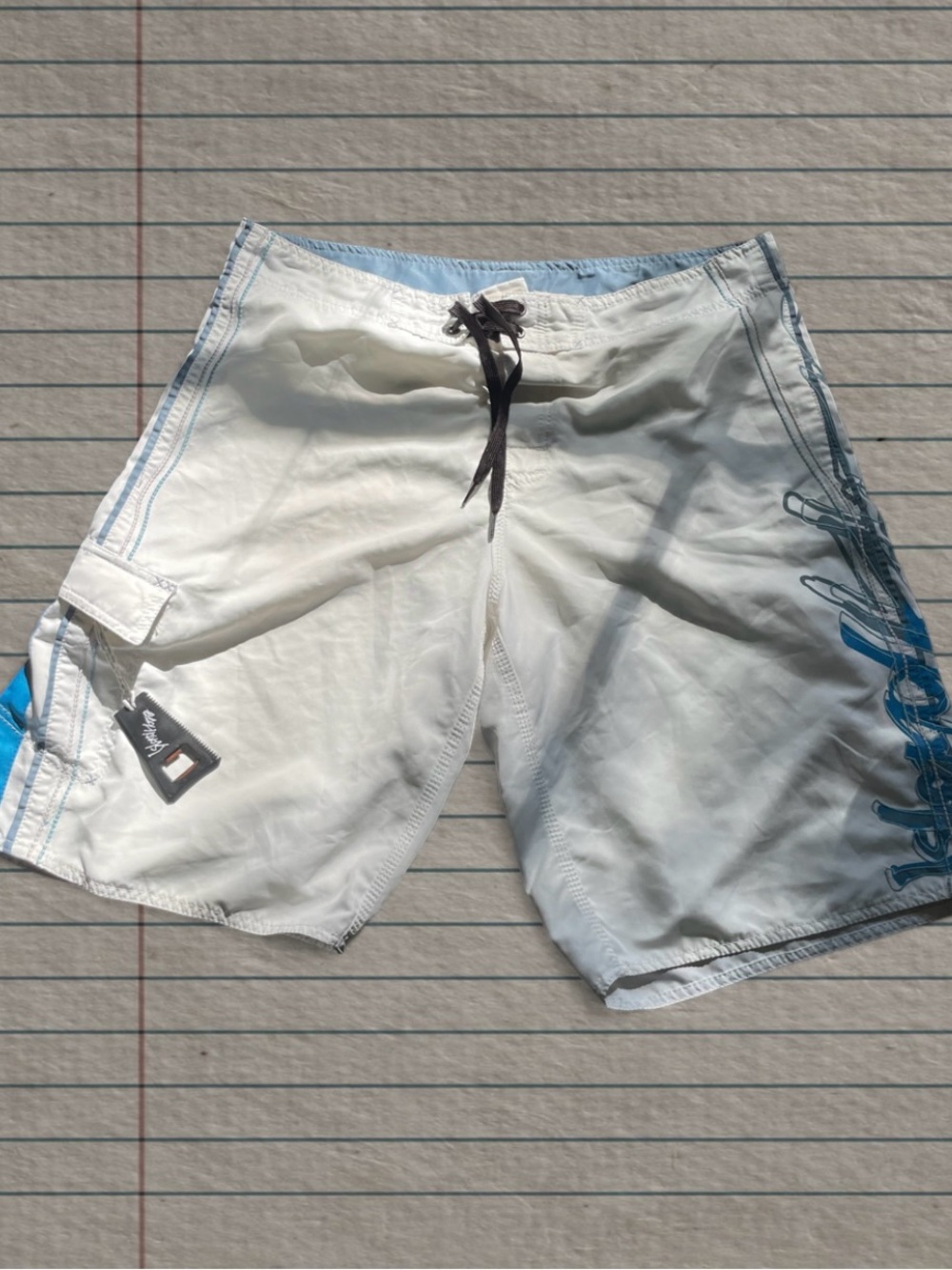 White Men's Swim Trunks with Blue Side Graphics